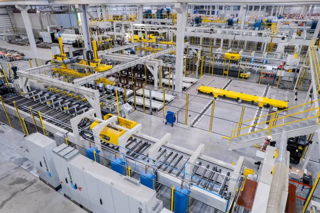 Expansion project in an aluminum extrusion plant with new extrusion equipment installation, industrial automation integration, and minimized production downtime.