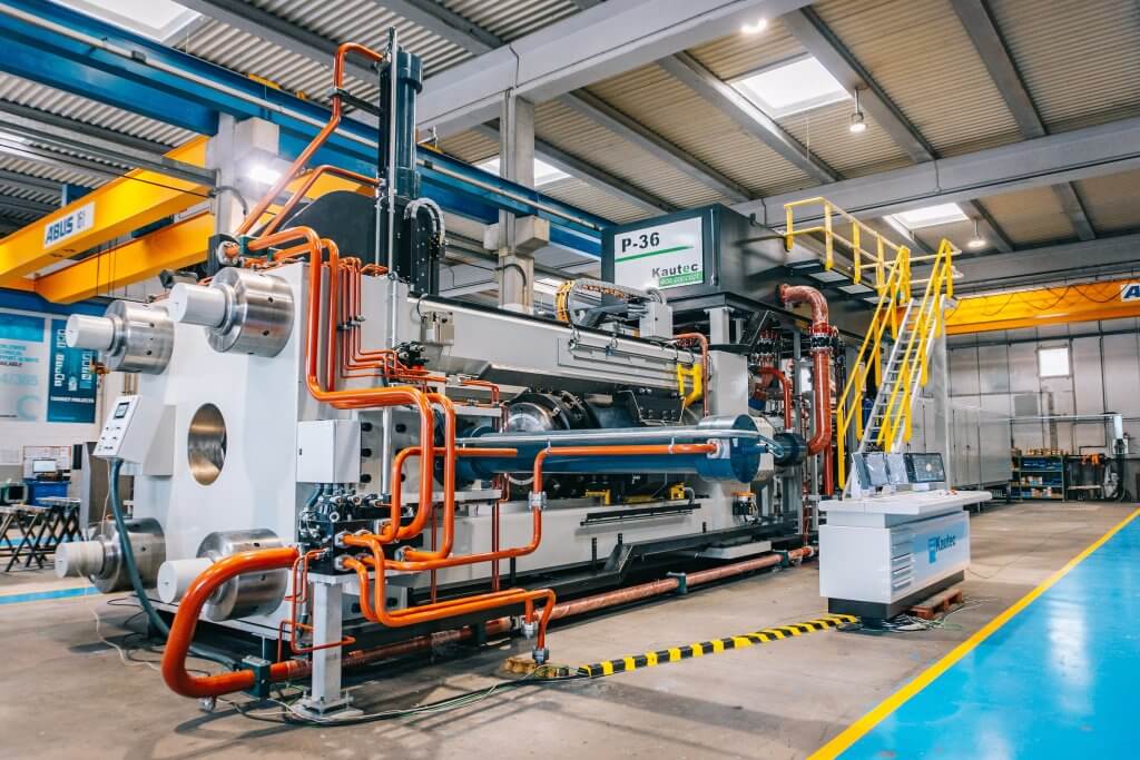 Heavy-duty industrial extrusion press machine processing what is extruded aluminum profiles in a fully automated manufacturing line